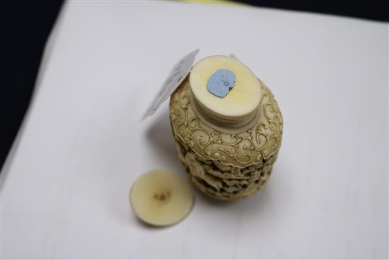 A 19th century Chinese ivory snuff bottle and stopper H.9cm